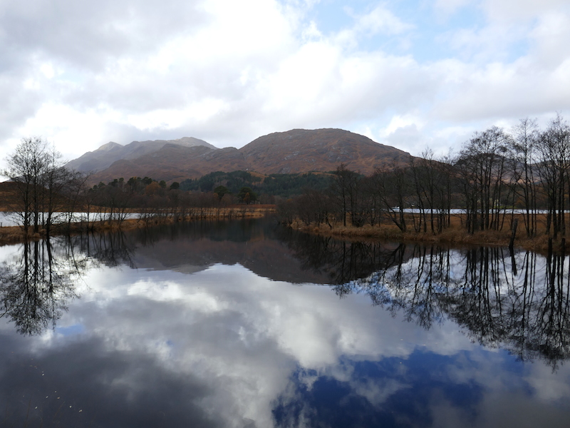 Hill reflected in lake - Fort William car-free adventures