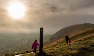 Family walking towards Mam Tor in the mist, Edale, Derbyshire